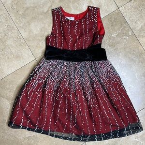 Girl’s holiday dress with sparkle details and velvet bow
